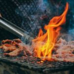 Barbecue - Close-Up Photo of Man Cooking Meat