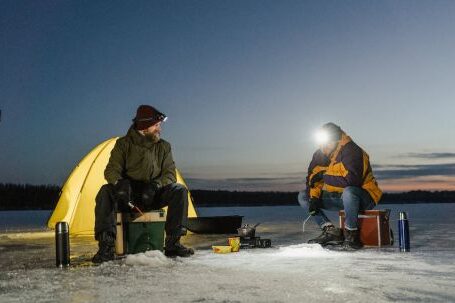 Fishing - Men Fishing in a Frozen Lake