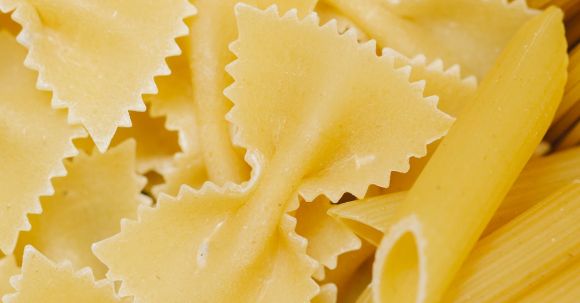 Southern Cuisine - From above of Italian uncooked farfalle penne and spaghetti made with traditional dough recipe