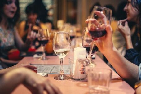Wine Tasting - People Drinking Liquor and Talking on Dining Table Close-up Photo